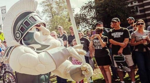 Sparty mascot with onlookers